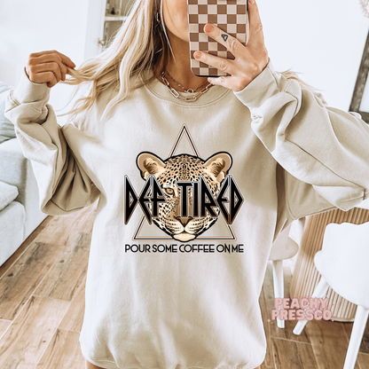 Sand crewneck sweatshirt featuring the Def Tired Pour Some Coffee On Me leopard graphic for coffee lovers.