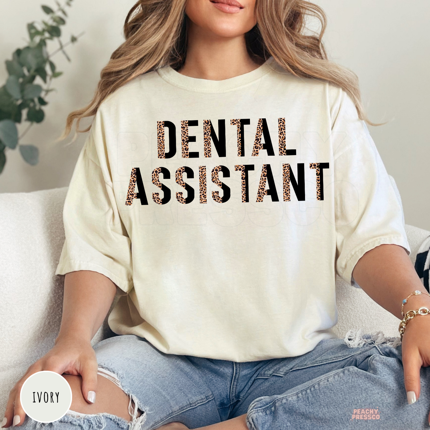 Ivory unisex t-shirt featuring a leopard print Dental Assistant design, perfect for dental assistants, dental office staff, and dental professional gifts.