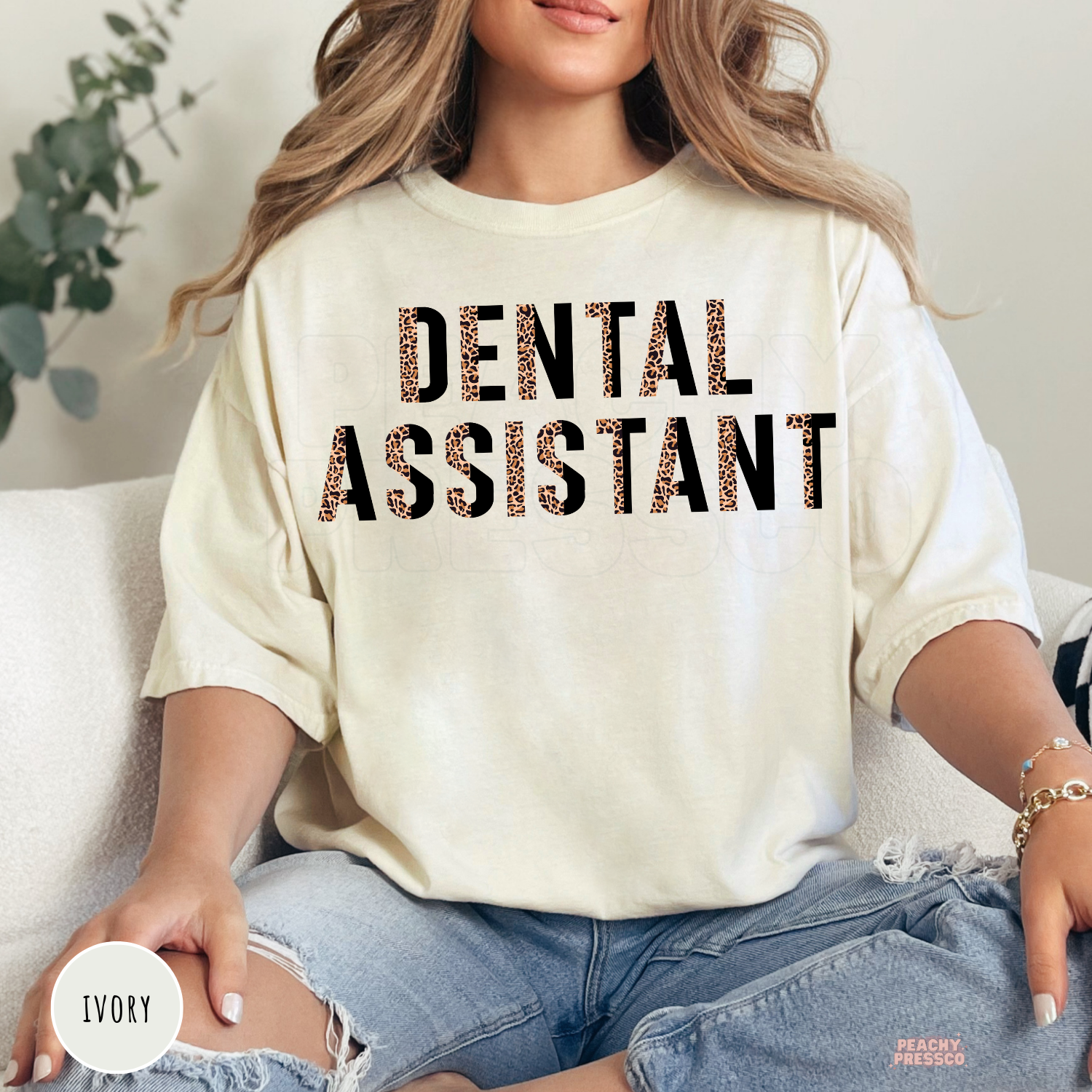 Ivory unisex t-shirt featuring a leopard print Dental Assistant design, perfect for dental assistants, dental office staff, and dental professional gifts.