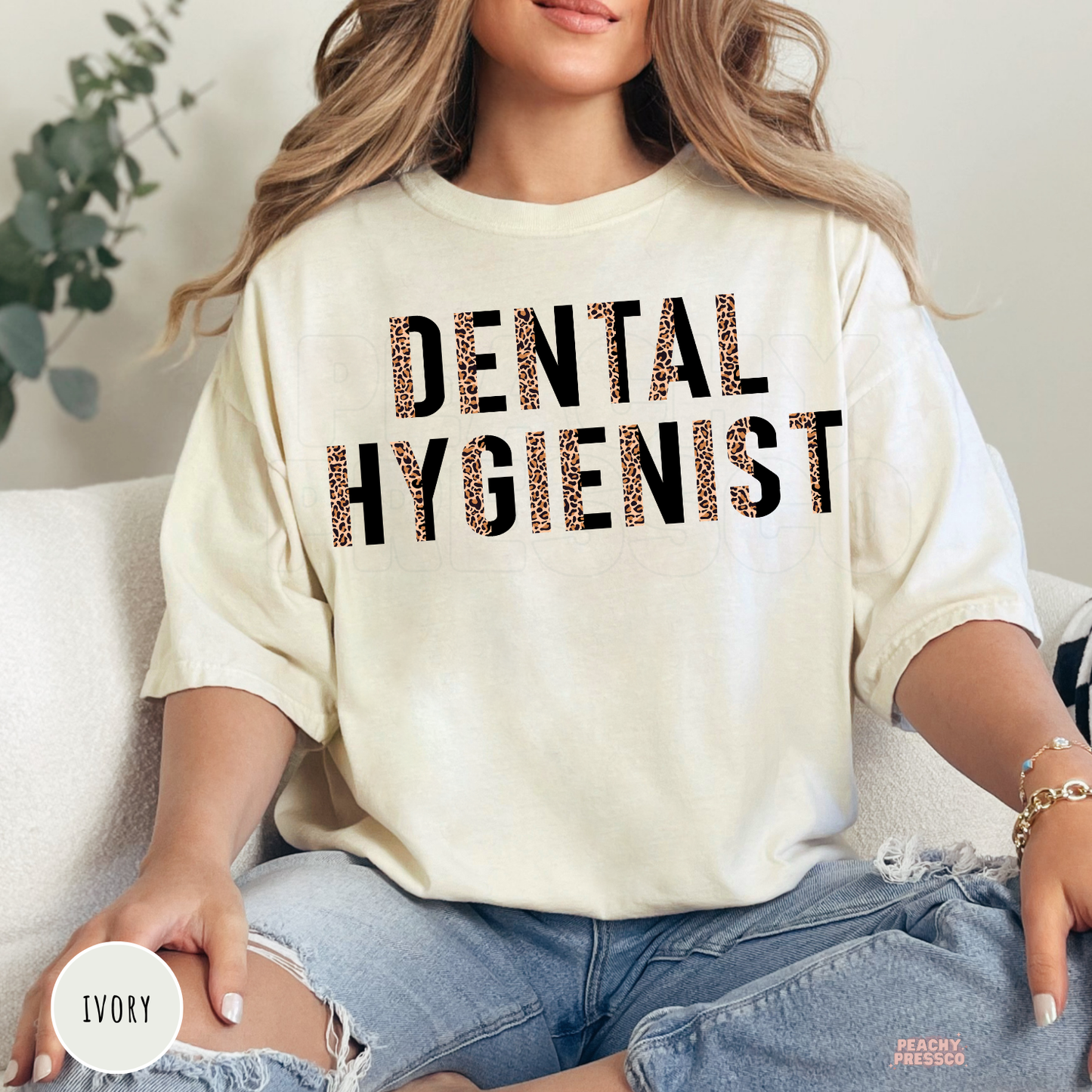 Ivory unisex t-shirt with a bold leopard print Dental Hygienist design, perfect for dental hygienists, dentist office staff, and dental professional gifts.