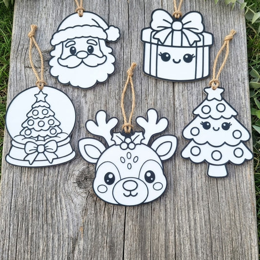 Set of five white outline Christmas ornaments featuring Santa, a gift box, a snow globe, a reindeer, and a tree designed for kids to colour in