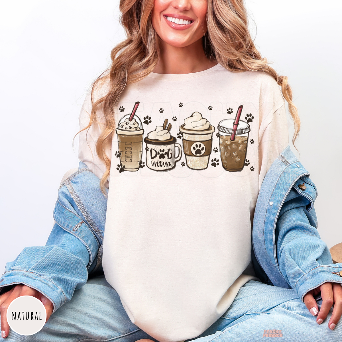 Natural dog mom coffee sweatshirt with a coffee cup graphic, paw prints and a cozy neutral color palette
