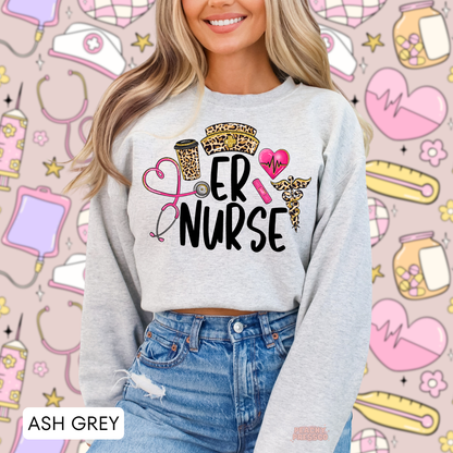 Ash grey ER Nurse sweatshirt featuring leopard print nurse hat, coffee cup, pink stethoscope, heartbeat heart and medical symbols.
