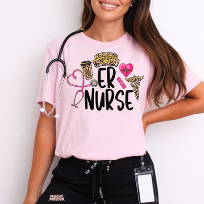 Light pink ER Nurse graphic T-shirt with leopard print nursing hat, pink heart stethoscope, coffee cup and medical symbols.
