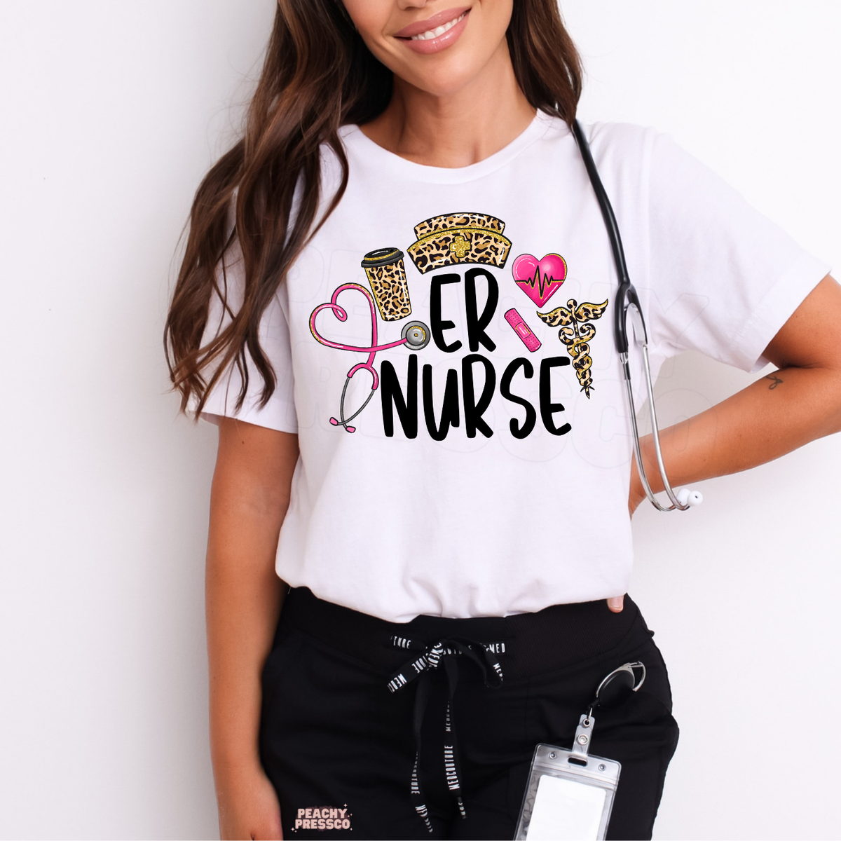 White ER Nurse T-shirt modeled with black scrub pants and stethoscope, featuring pink and leopard print nursing graphics.