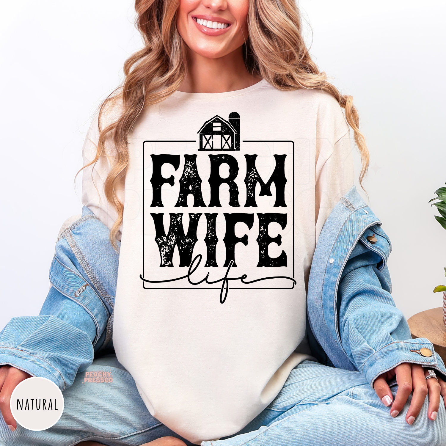 Natural colored Farm Wife Life shirt featuring a distressed farmhouse graphic in a rustic western farmhouse style.