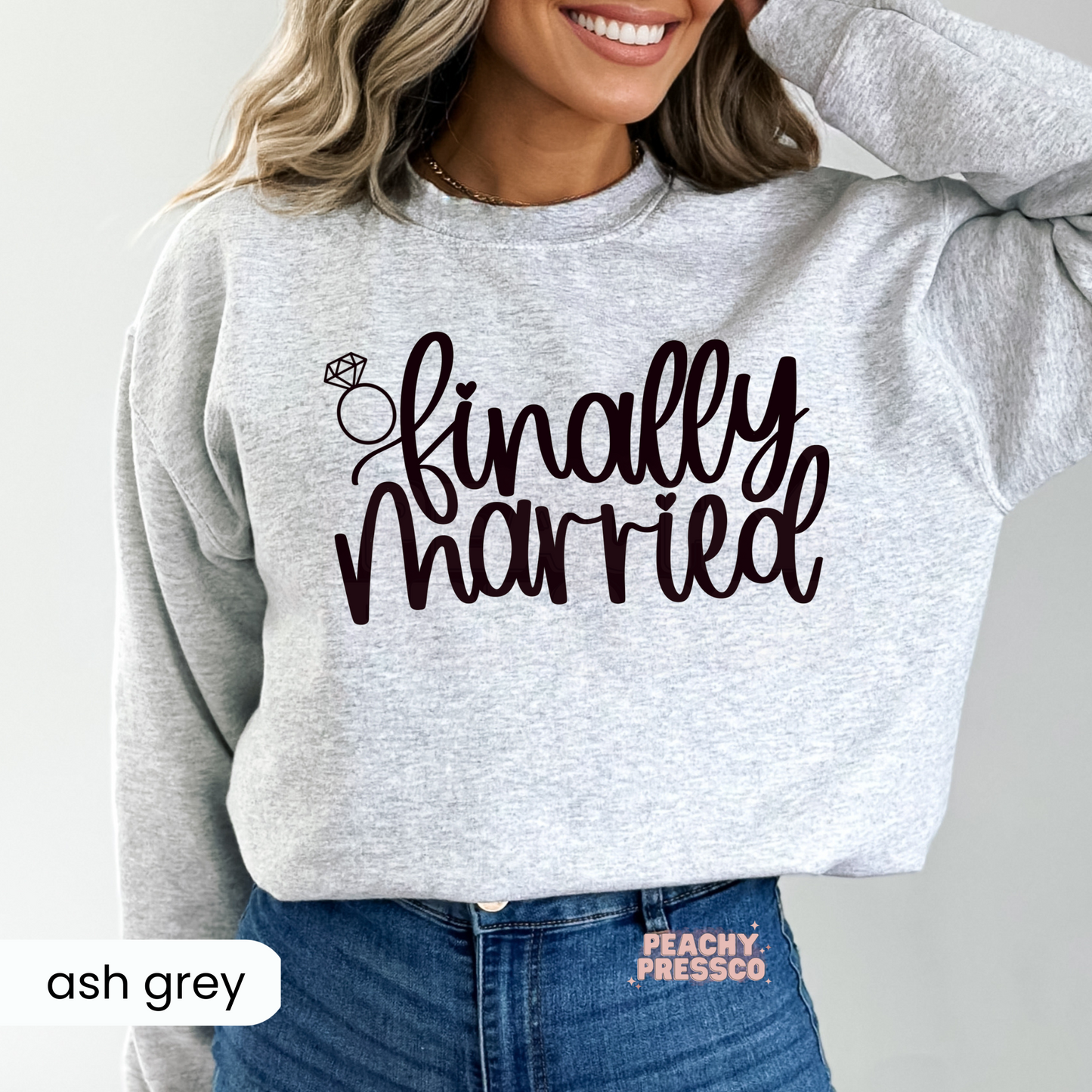 Ash grey sweatshirt with a stylish "Finally Married" design and diamond ring graphic, perfect for newlywed couples, bridal celebrations, honeymoon trips, and everyday post-wedding wear.
