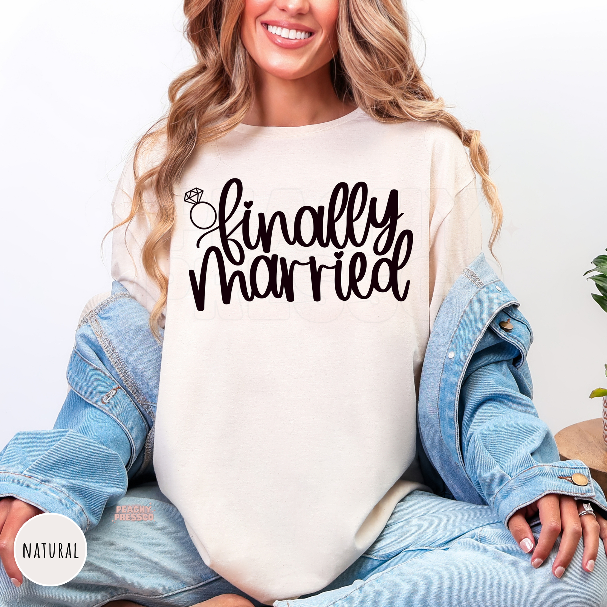 Natural Comfort Colors t-shirt displaying the "Finally Married" graphic in black with a diamond ring illustration, a stylish choice for brides, honeymoon travel, wedding weekends, and newlywed photos.