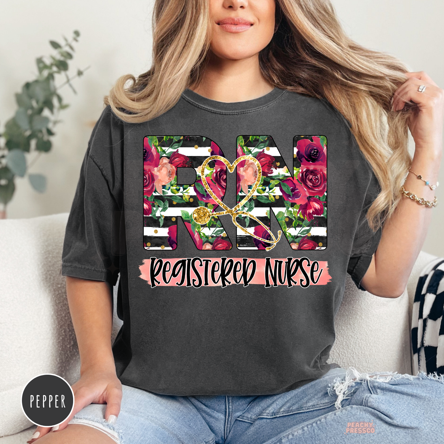 Pepper Comfort Colors t-shirt with a floral Registered Nurse RN design in burgundy flowers and black striped lettering.
