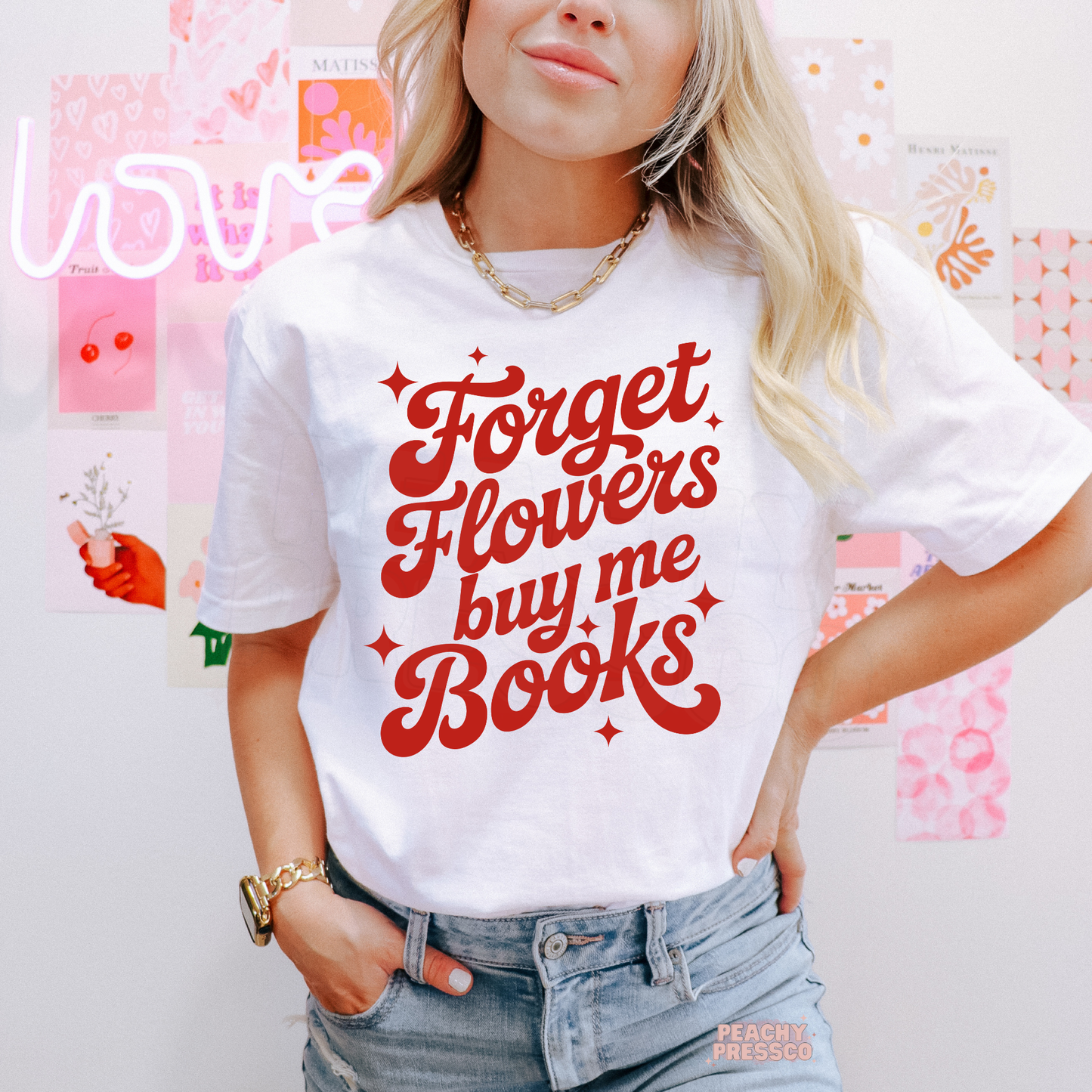 White unisex t-shirt displaying the retro "Forget Flowers Buy Me Books" design, a cute gift for readers and bookworms.