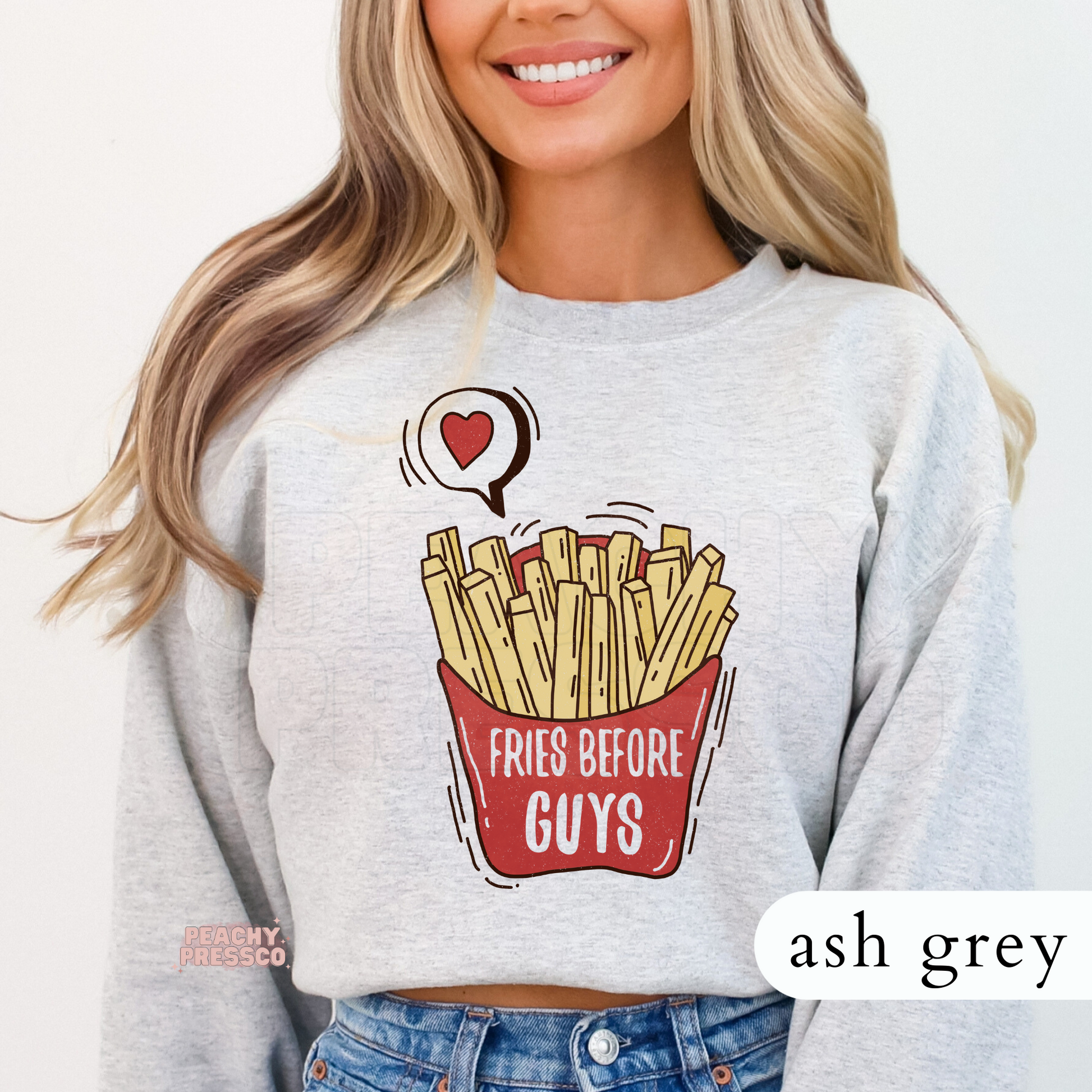 Ash grey crewneck sweatshirt with a retro "Fries Before Guys" graphic featuring french fries and a playful Valentine's-inspired design.