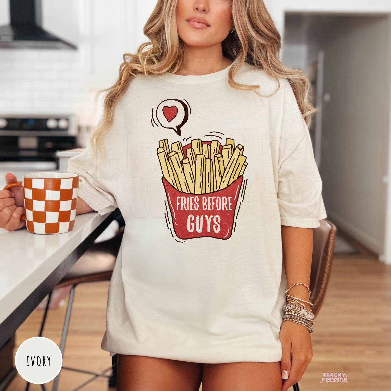 Ivory unisex t-shirt displaying a playful "Fries Before Guys" french fry graphic, perfect for Valentine's Day or Galentine's celebrations.