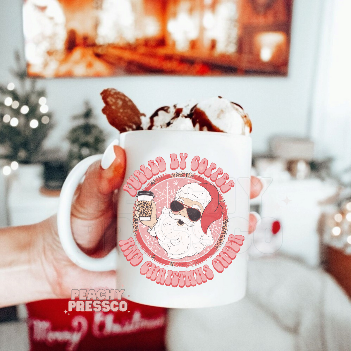 Ceramic Christmas mug featuring Santa Claus wearing sunglasses holding a leopard print coffee cup with text Fueled By Coffee And Christmas Cheer.