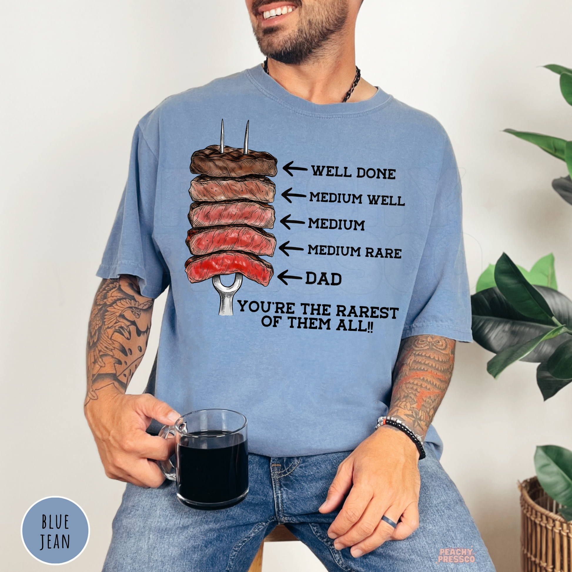 Blue Jean Comfort Colors t-shirt with a humorous steak doneness chart design labeling Dad as the rarest, perfect Father's Day BBQ gift.
