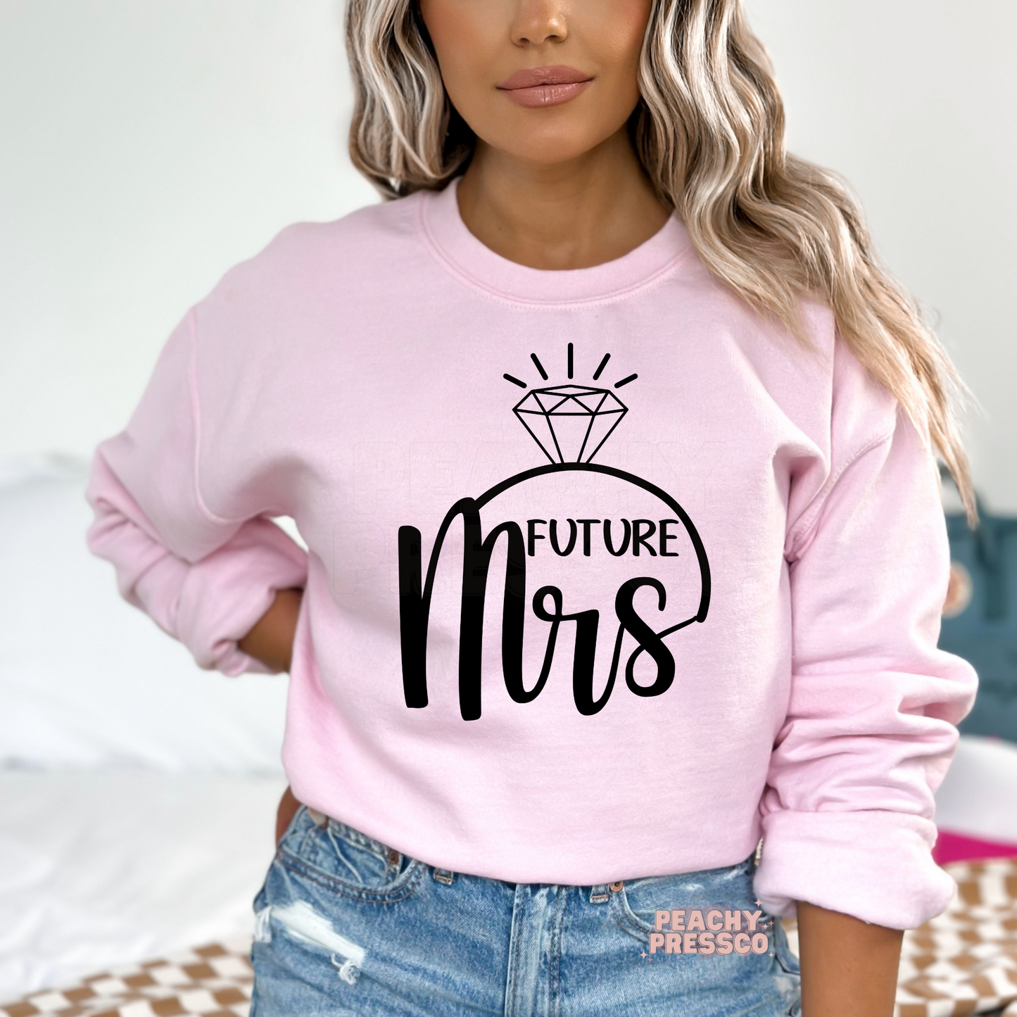 Light pink crewneck sweatshirt with a modern "Future Mrs" engagement ring graphic, ideal for brides-to-be, engagement celebrations, bridal showers, bachelorette weekends, and wedding gifts.