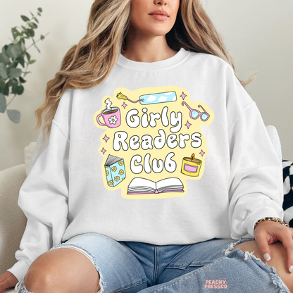 White crewneck sweatshirt featuring the Girly Readers Club design with pastel reading-themed illustrations for bookworms.