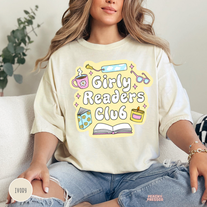 Ivory Comfort Colors tee featuring the Girly Readers Club design with coffee mug, floral book, bookmark, candle, glasses, and open book.