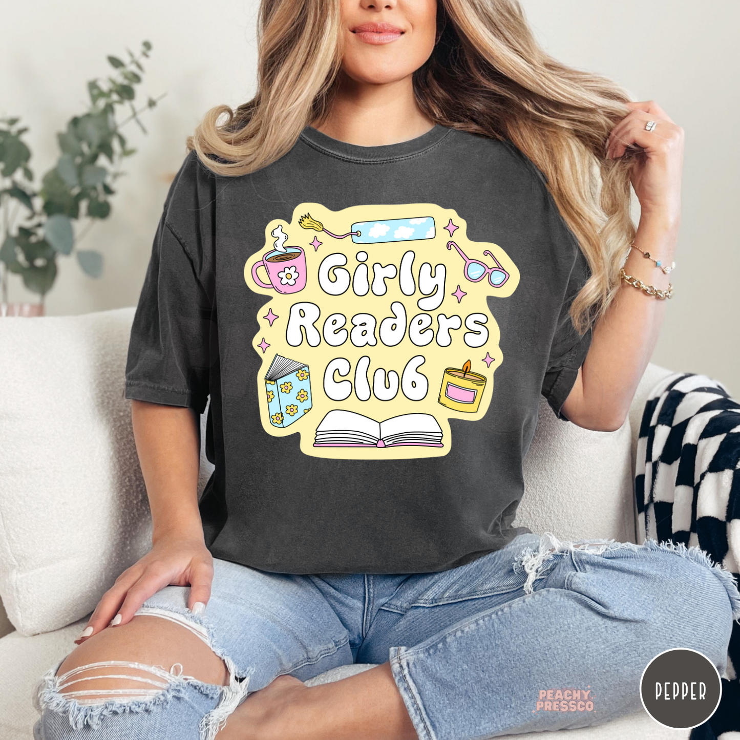 Pepper Comfort Colors tee featuring the Girly Readers Club graphic with cozy book lover illustrations and pastel reading accessories.