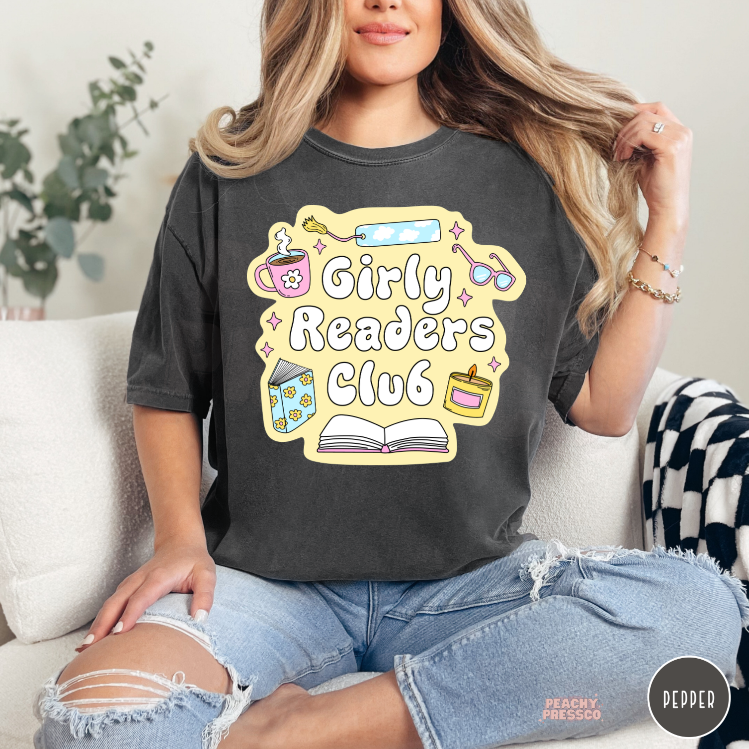 Pepper Comfort Colors tee featuring the Girly Readers Club graphic with cozy book lover illustrations and pastel reading accessories.
