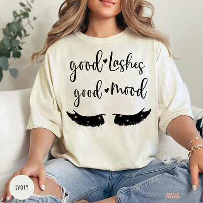 Ivory unisex t-shirt with a Good Lashes Good Mood design and eyelash illustration, an ideal shirt for lash technicians, estheticians, and beauty salon professionals.
