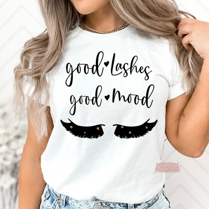 White unisex t-shirt featuring a Good Lashes Good Mood graphic with eyelash illustration, a trendy shirt for lash technicians, estheticians, and beauty salon professionals.