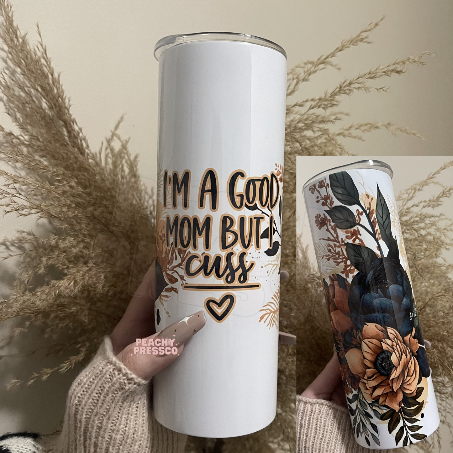 20oz skinny tumbler with navy and blush floral artwork and the phrase I'm a Good Mom But I Cuss.