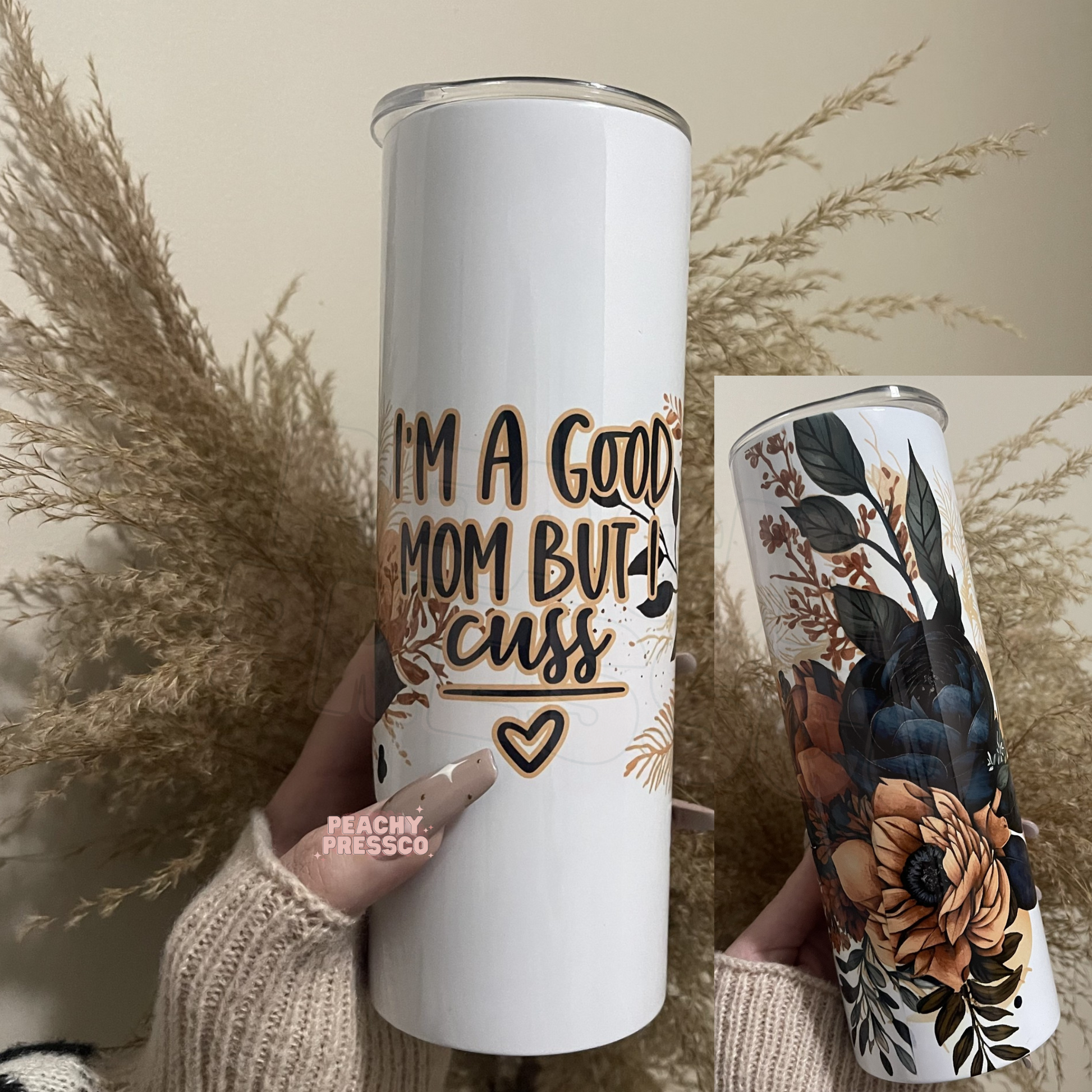 20oz skinny tumbler with navy and blush floral artwork and the phrase I'm a Good Mom But I Cuss.