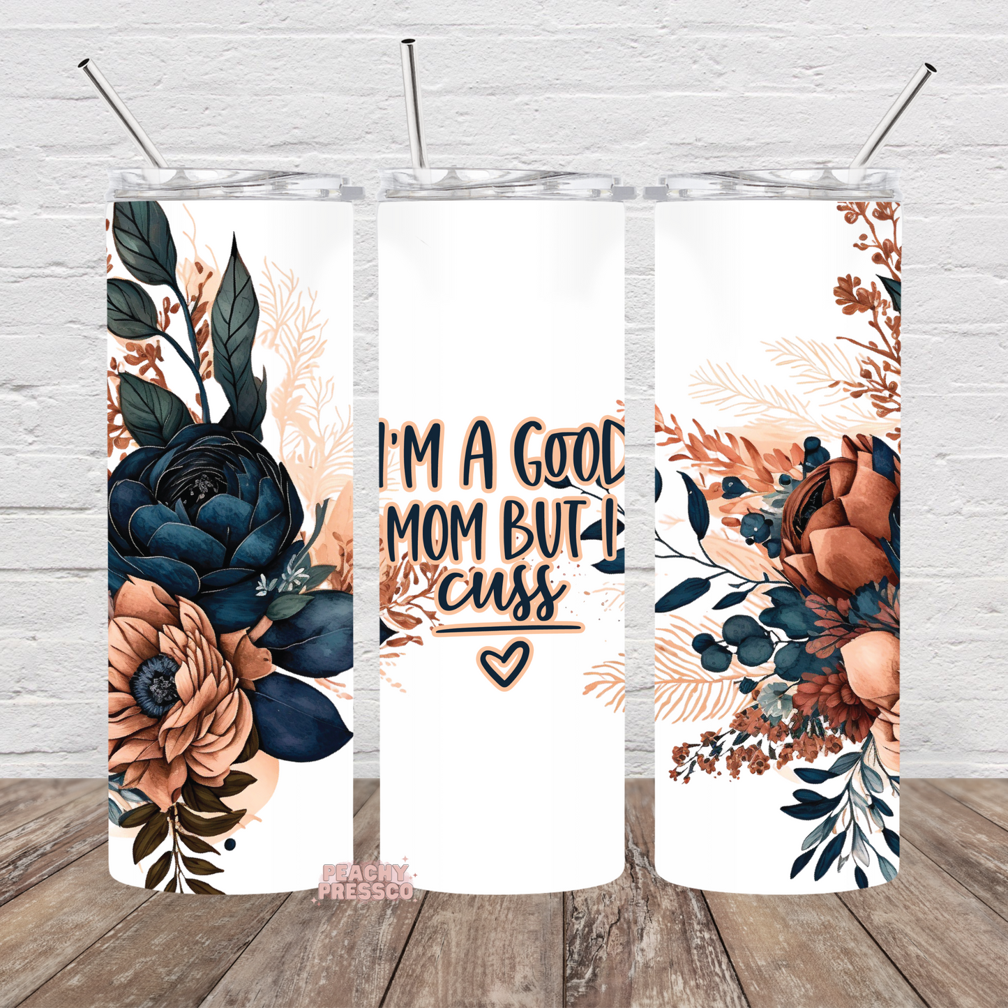 20oz tumbler with navy and blush floral artwork and the phrase I'm a Good Mom But I Cuss.