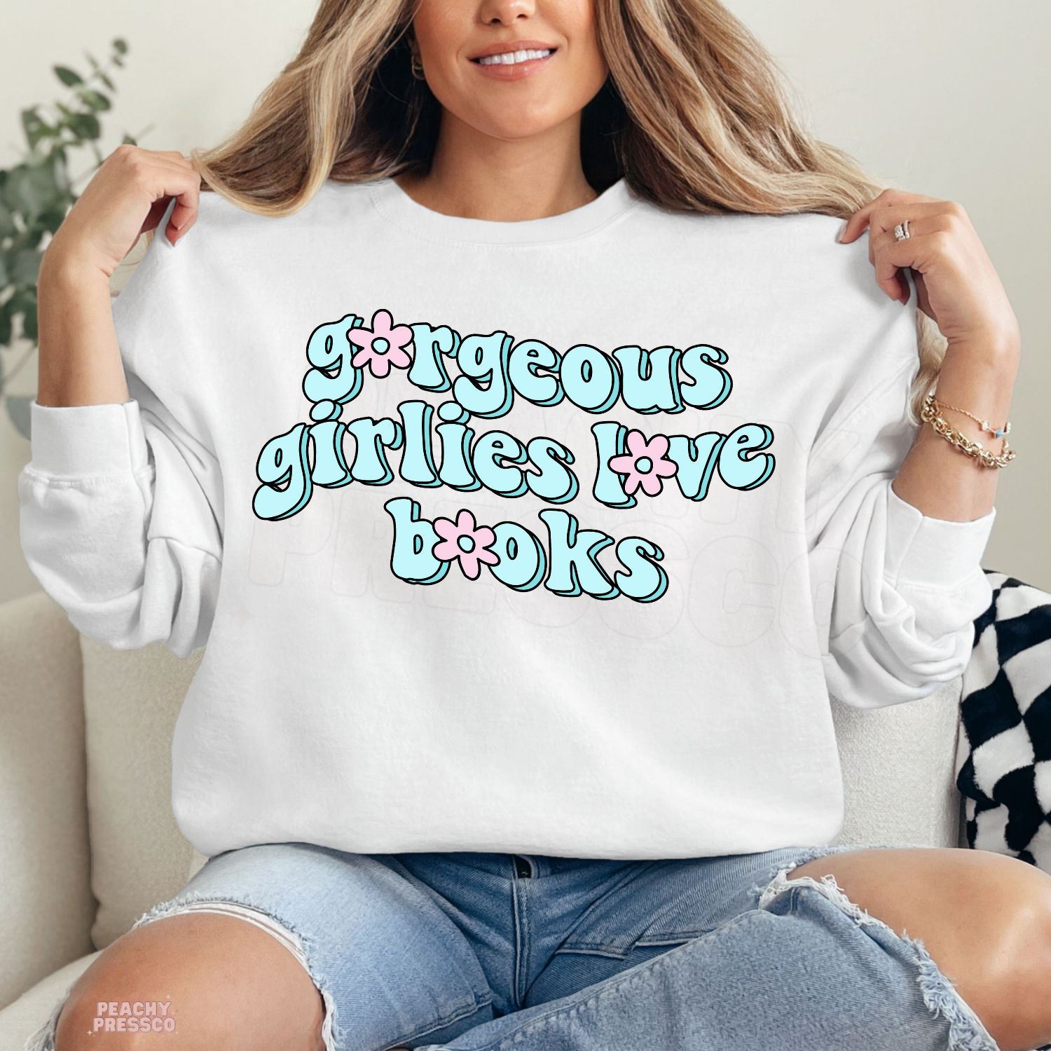 White crewneck sweatshirt with the "Gorgeous Girlies Love Books" graphic in retro pastel lettering, perfect for cozy book lovers.
