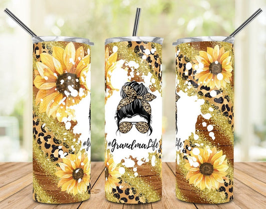 20oz skinny tumbler featuring sunflowers, leopard print, glitter, and Grandma Life messy bun design.