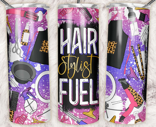 20oz skinny tumbler featuring a "Hair Stylist Fuel" design with leopard-print salon tools, spray bottles, combs, brushes, scissors, and hairstyling accessories on a purple background.