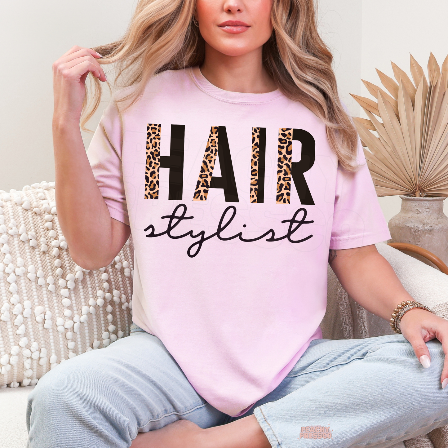Soft pink unisex t-shirt featuring a leopard print Hair Stylist design, perfect for hairstylists, cosmetologists, salon professionals, and beauty lovers.