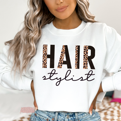 White crewneck sweatshirt featuring a leopard print Hair Stylist design, perfect for hairstylists, salon owners, cosmetologists, and beauty professionals.