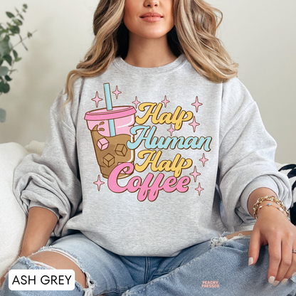 Ash grey Half Human Half Coffee sweatshirt featuring a colourful iced coffee illustration and playful retro coffee lettering.