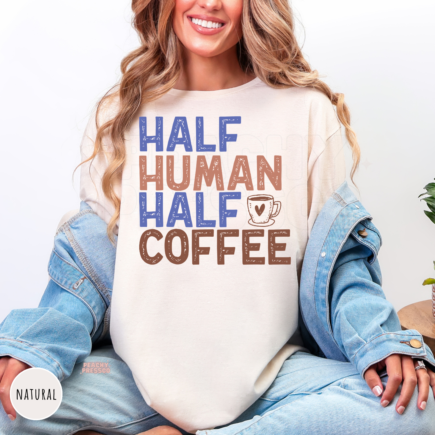Natural shirt with the humorous "Half Human Half Coffee" graphic and coffee mug design for coffee lovers.