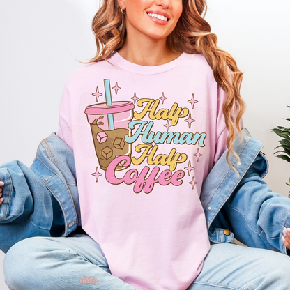 Light pink Half Human Half Coffee sweatshirt featuring a colourful iced coffee illustration and retro-inspired coffee lover quote.
