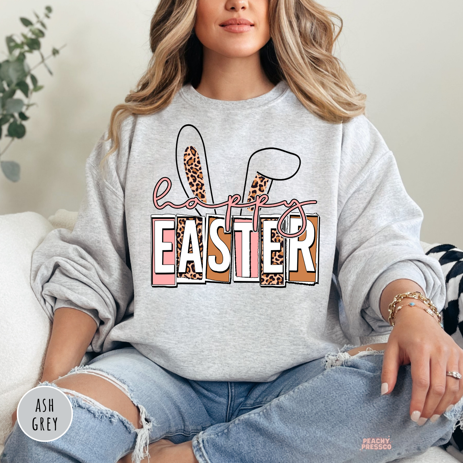 Ash grey crewneck sweatshirt featuring a Happy Easter bunny ears design with leopard print and pink accents.