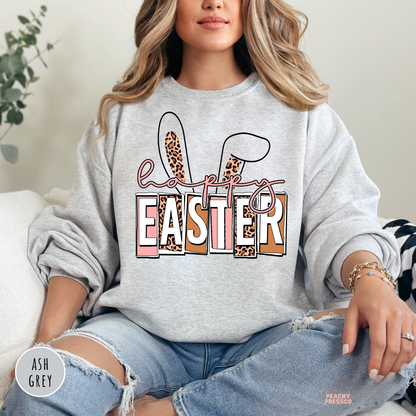 Ash grey crewneck sweatshirt featuring a Happy Easter bunny ears design with leopard print and pink accents.