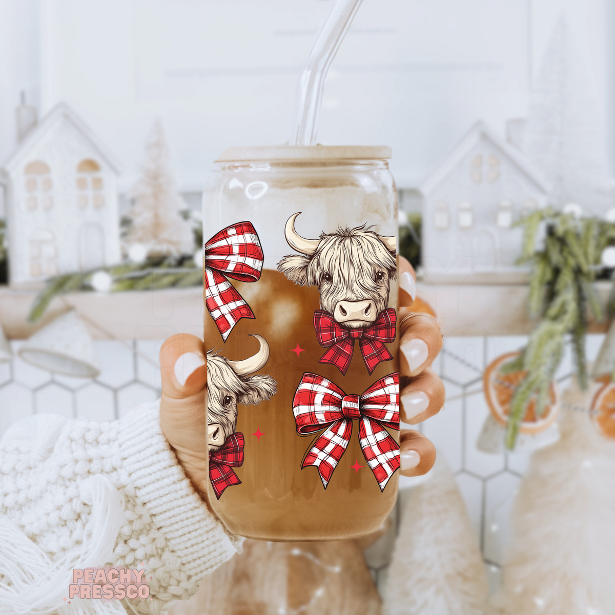 16oz clear glass iced coffee cup with bamboo lid featuring cute Highland cows wearing red plaid bows.
