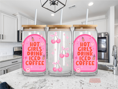 Glass cup featuring the phrase "Hot Girls Drink Iced Coffee" with pink cherries, smiley faces, sparkles, and retro pink graphics.