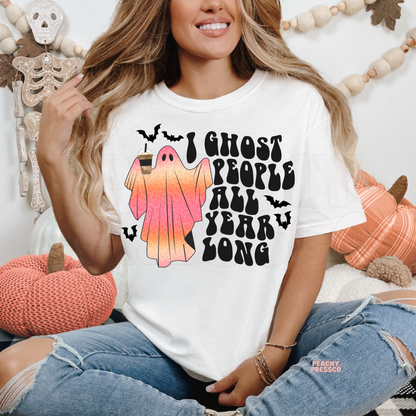 White funny Halloween shirt featuring a pink coffee ghost, bats and I Ghost People All Year Long graphic