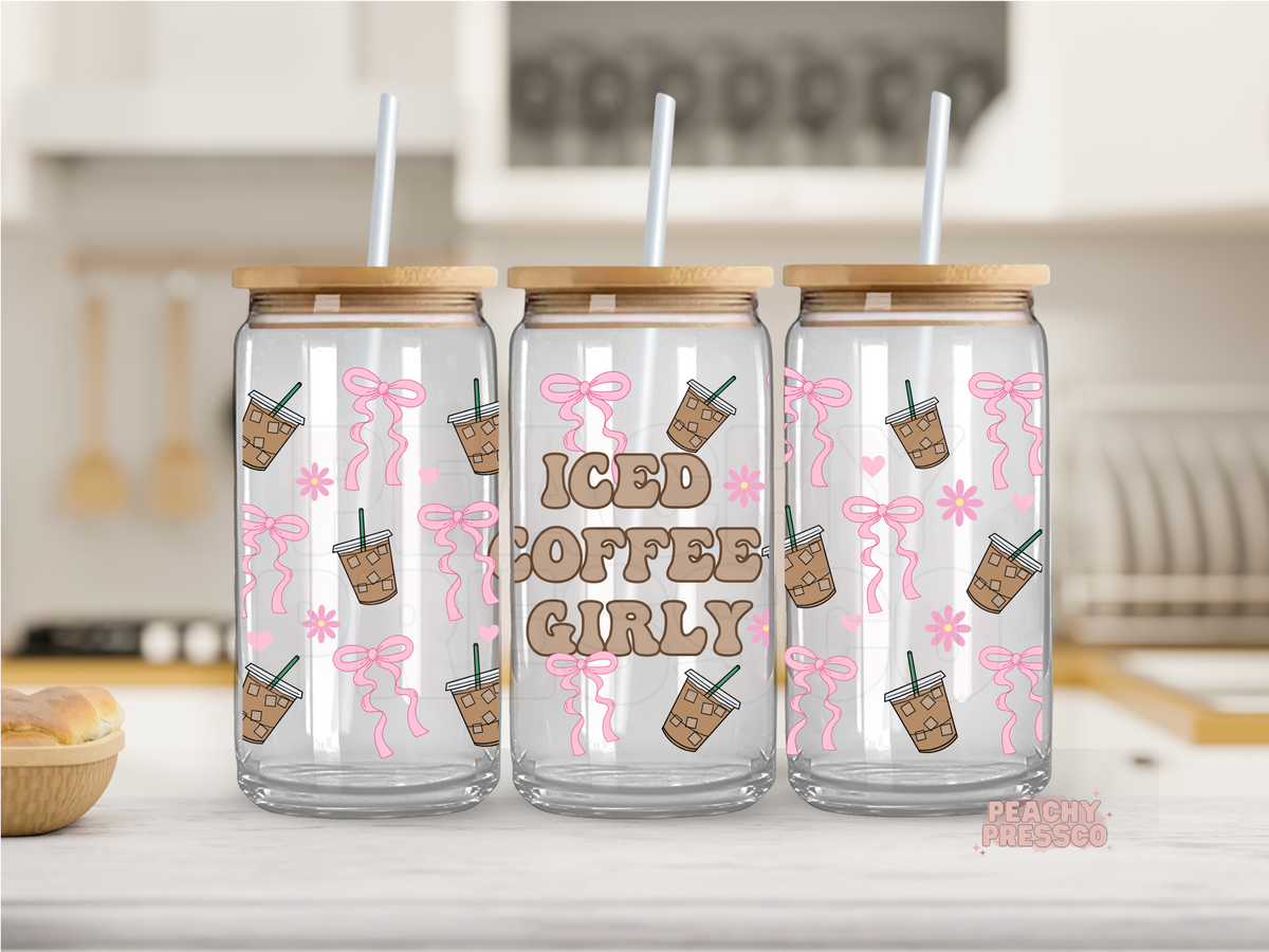 Glass can tumbler with pink bows, iced coffee cups, flowers, and the phrase "Iced Coffee Girly" wrapped around the design.
