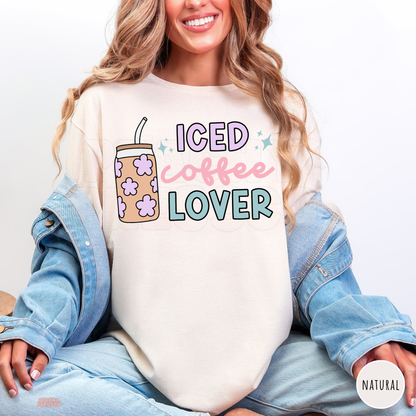 Natural Iced Coffee Lover shirt with pastel pink, lavender and teal lettering, floral iced coffee tumbler and cute blue sparkles.