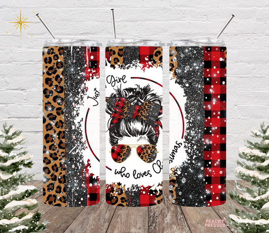 20oz tumbler featuring a messy bun girl in sunglasses with text Just A Girl Who Loves Christmas, surrounded by leopard print, black glitter, and red buffalo plaid.