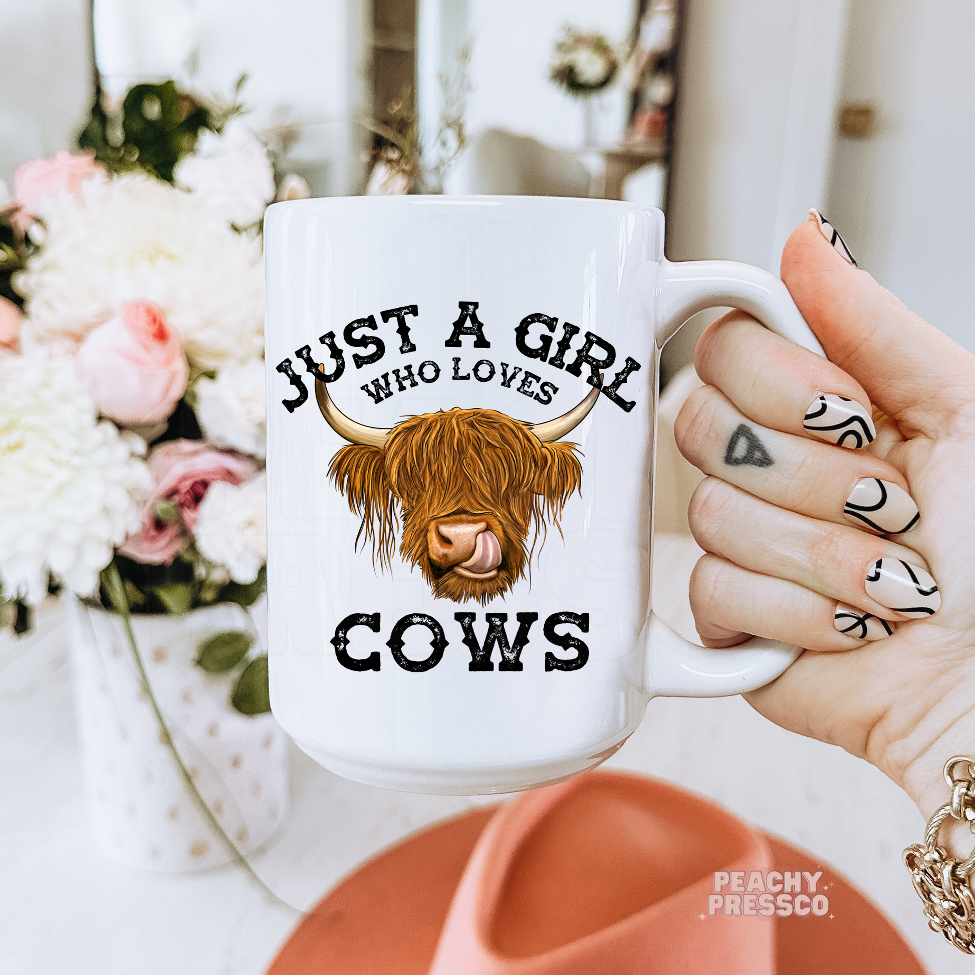 White ceramic coffee mug featuring a Highland cow illustration and the phrase "Just a Girl Who Loves Cows," making a perfect gift for cow lovers and farm girls.