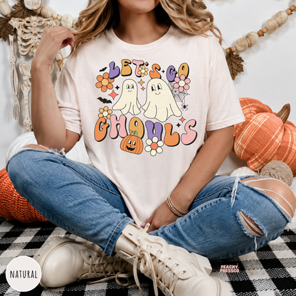Natural Let’s Go Ghouls Halloween T-shirt featuring cute ghosts, pumpkin, bats and colorful retro floral graphics