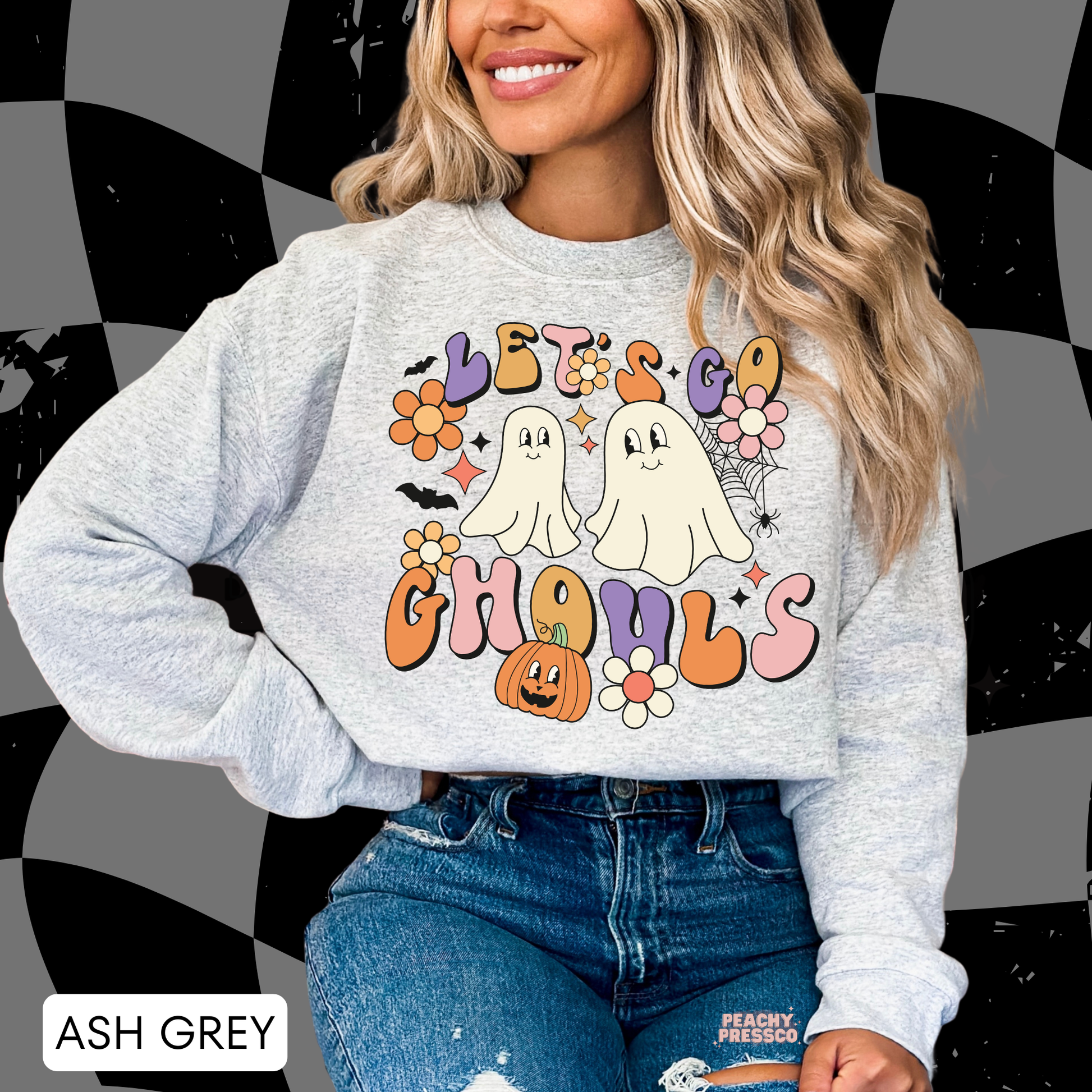 Ash grey Let’s Go Ghouls Halloween sweatshirt featuring cute retro ghosts, pumpkin, bats and colorful groovy flowers