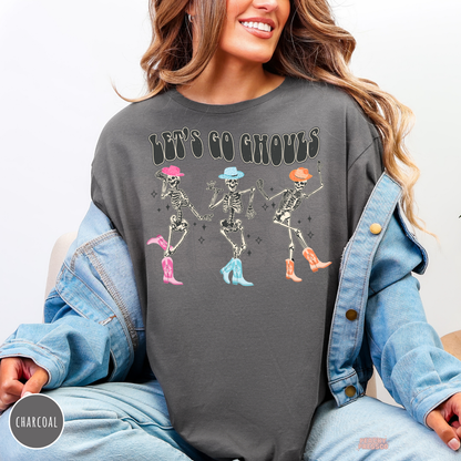 Charcoal Halloween T-shirt featuring Let’s Go Ghouls dancing skeleton cowgirls with colorful cowboy hats and boots