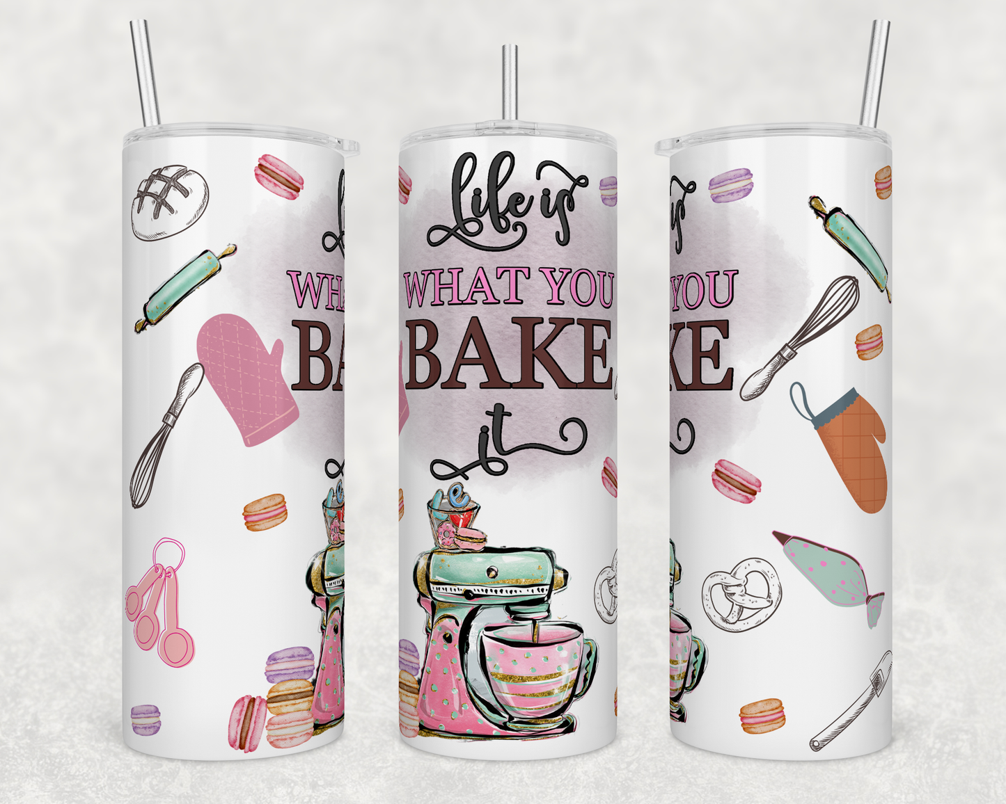 20oz stainless steel tumbler featuring the phrase "Life Is What You Bake It" with a vintage stand mixer, baking utensils, macarons, rolling pin, whisk, oven mitts, and pastel baking accents.
