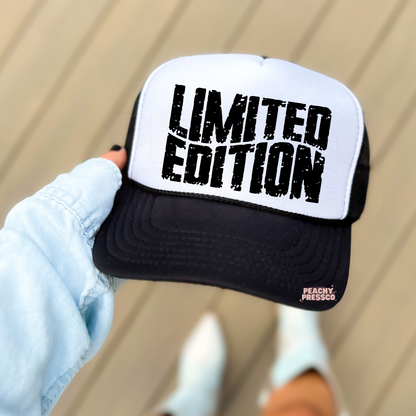 Black and white foam trucker hat featuring bold distressed "LIMITED EDITION" lettering. Fashion-forward unisex trucker cap for streetwear, country concerts, vacations, and everyday style.